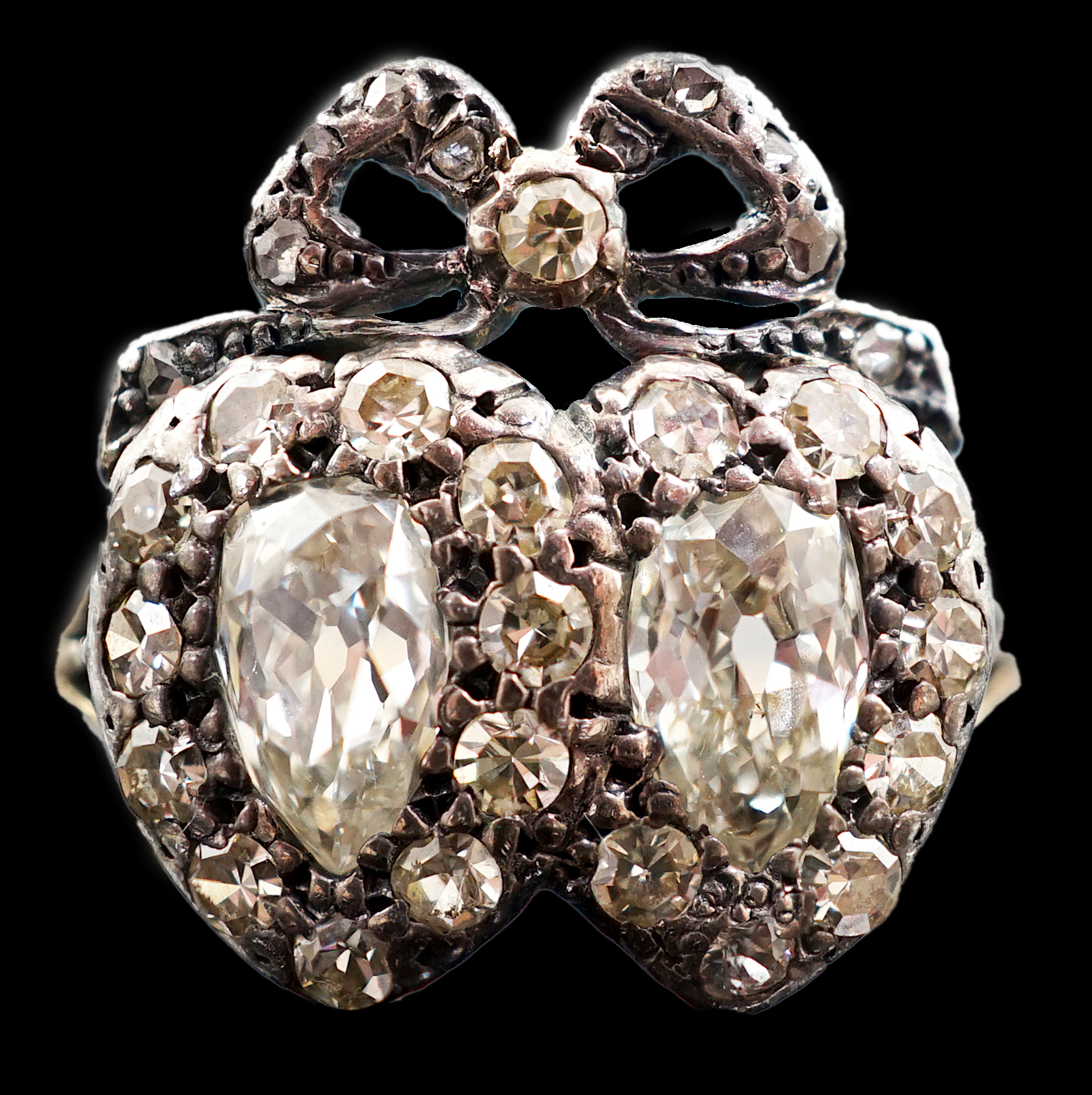 A 19th century gold, silver and diamond cluster set twin hearts ring, with ribbon bow surmounted
